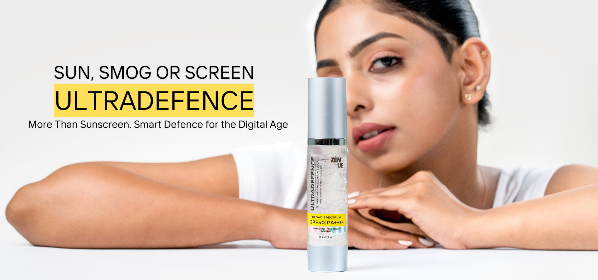 Woman with a skincare product labeled ZENUE ULTRADEFENCE on a white background