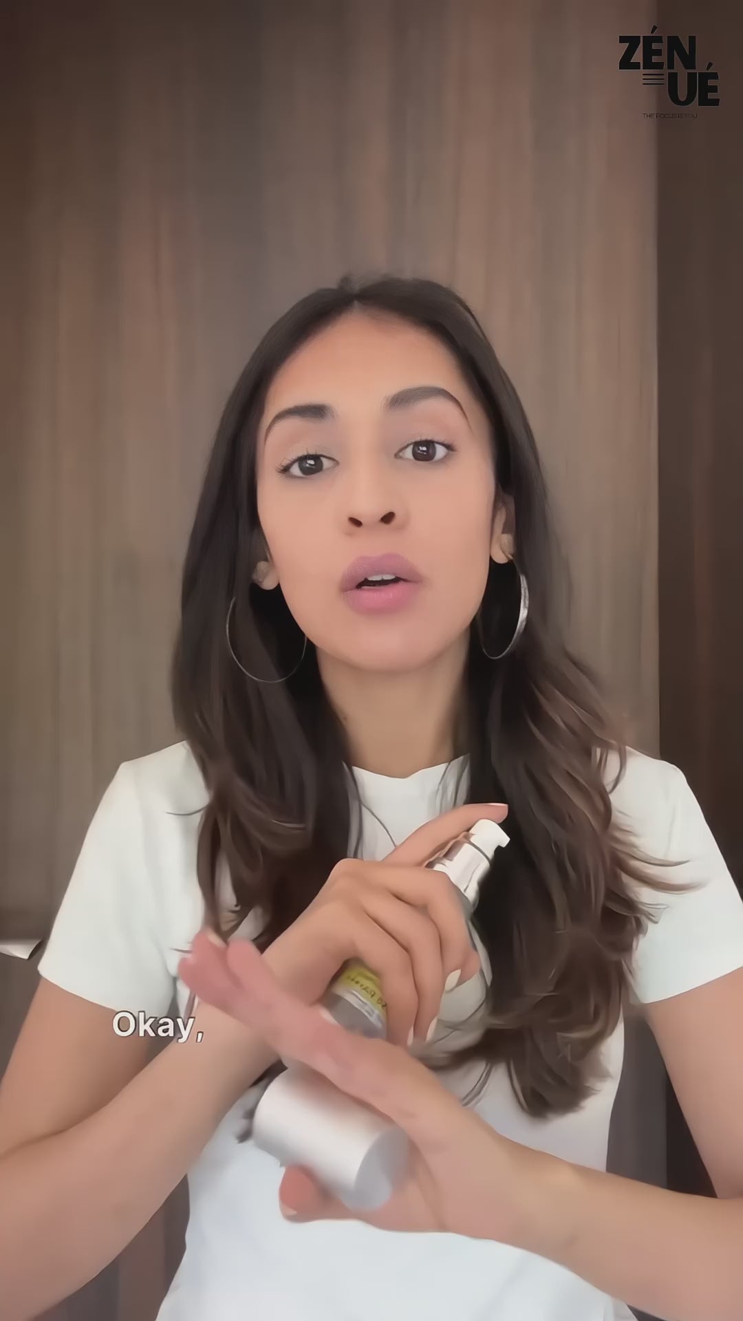 a girl applying ultradefence sunscreen by zenue and it is clearly visible that the sunscreen is non greasy and no white cast